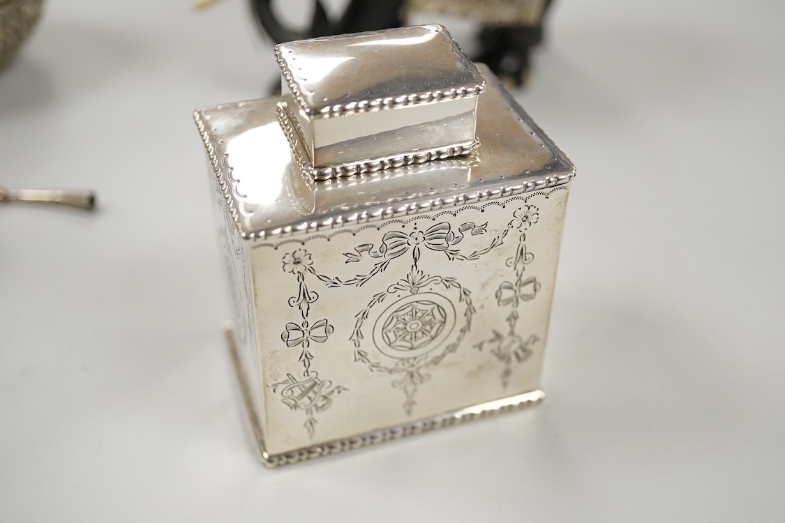 A George V engraved silver rectangular tea caddy, by Nathan & Hayes, Chester, 1913, 81mm, together with an Edwardian repousse silver mounted ring box by Nathan & Hayes, Chester, 1905, a Scottish silver and tortoiseshell